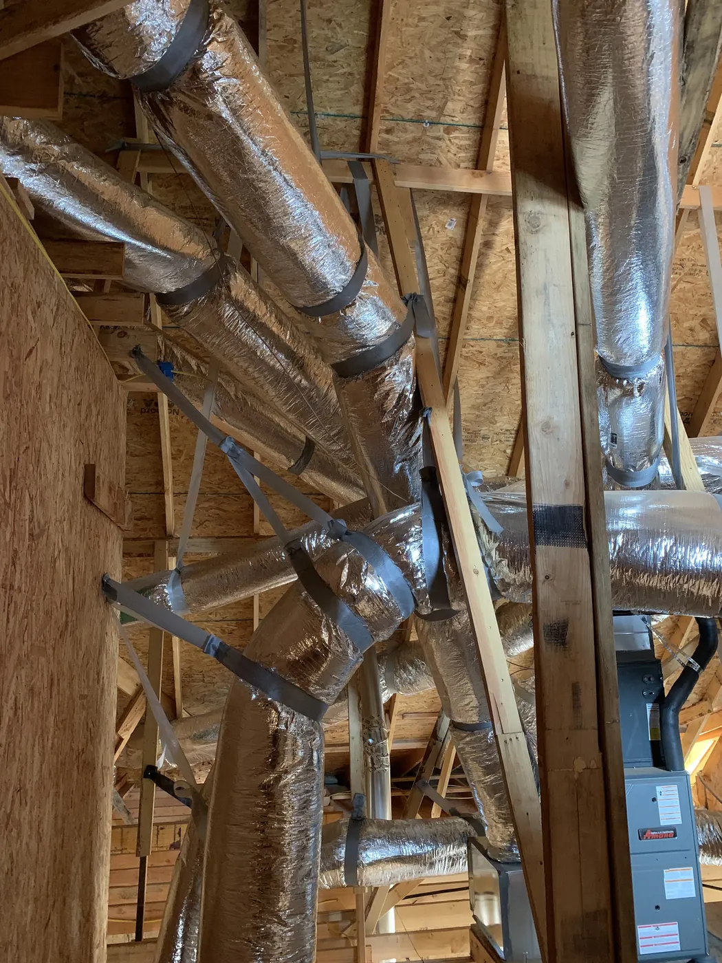 New sheet-metal and flex ductwork run during a home build